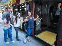 family-hopping-on-a-big-bus-tour-in-new-york_2.webp